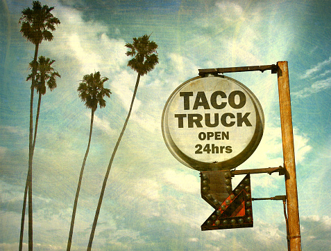 aged and worn taco truck sign