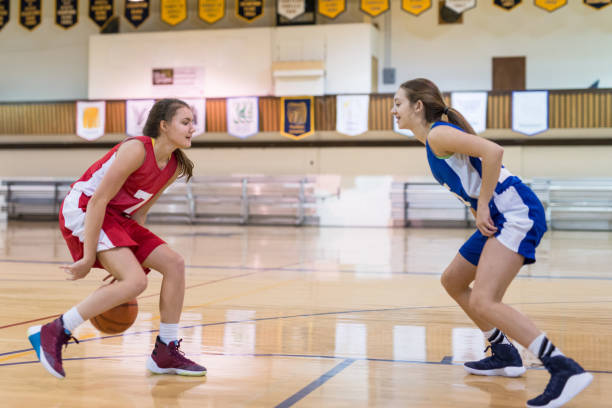 istock Girls high school basketball game 874682828