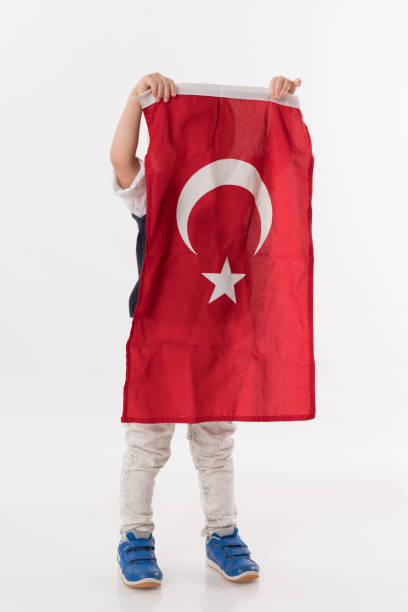 istock Little child with turkish flag 874685504