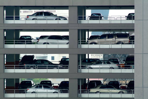 istock Car Parking lot building 874685534