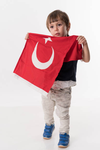 istock Little child with turkish flag 874686088