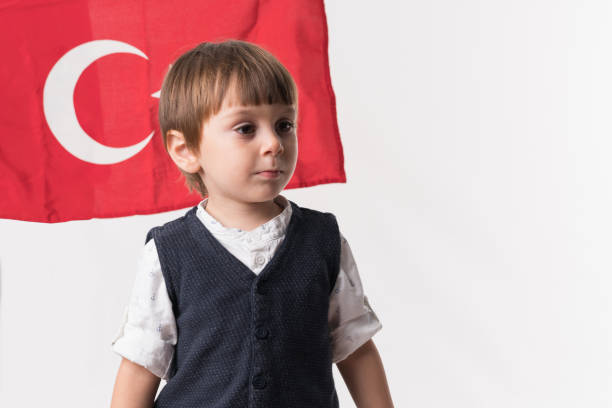 istock Little child with turkish flag 874686440