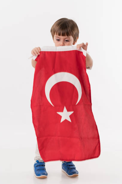istock Little child with turkish flag 874686508