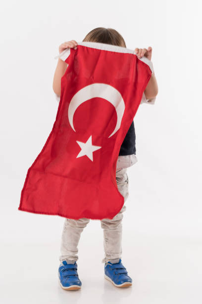 istock Little child with turkish flag 874686576
