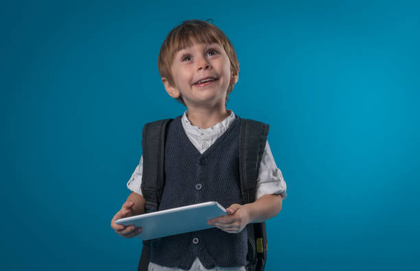 lindo menino de escola - child little boys isolated standing - fotografias e filmes do acervo