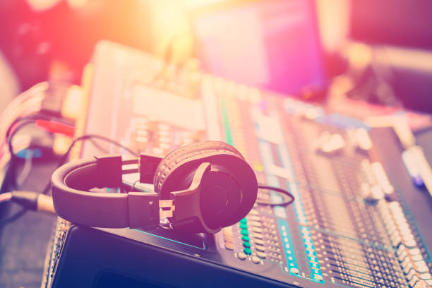 Dj mixer with headphones at a nightclub, music