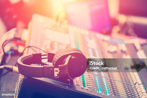 Audio Sound Mixer Adjusting Professional Sound Engineer Operator In Concert Hall Stock Photo - Download Image Now