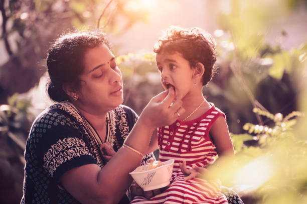 istock Mother feeding baby 874696470