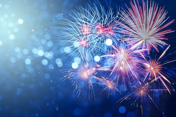 istock Abstract fireworks celebration on bokeh festive  light background 874697572