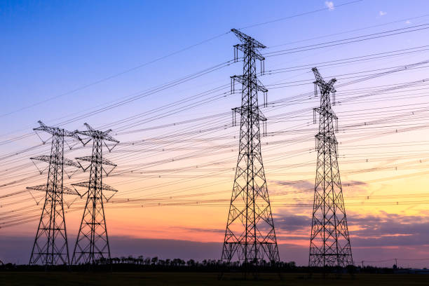 istock High voltage power tower landscape at sunset 874700386