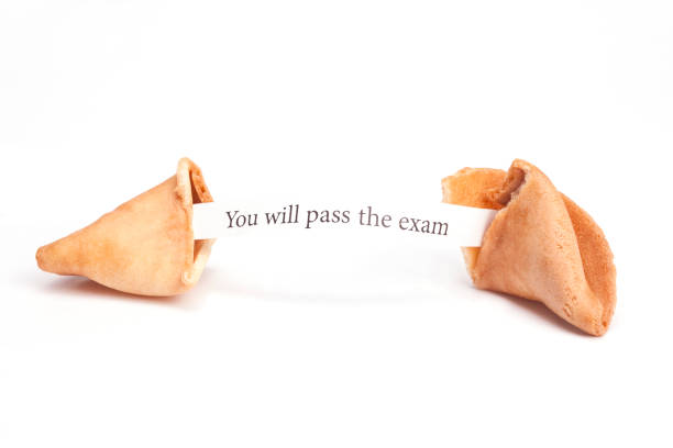 Broken fortune cookie with You will passed the exam! fortune stock photo