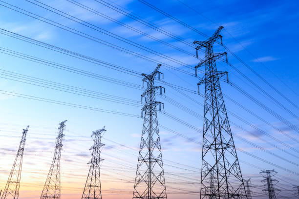 istock High voltage power tower landscape at sunset 874704008