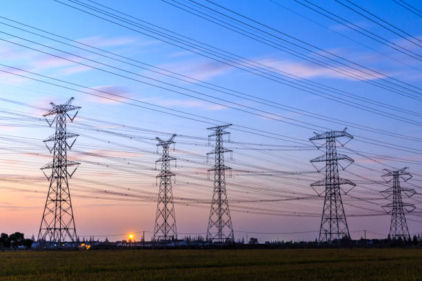 istock High voltage power tower landscape at sunset 874704048