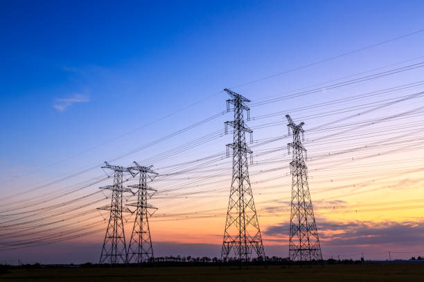 istock High voltage power tower landscape at sunset 874704126