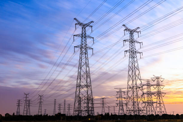 istock High voltage power tower landscape at sunset 874704134