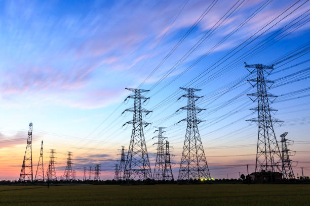 istock High voltage power tower landscape at sunset 874704262