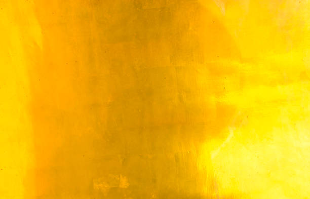 istock Shiny yellow leaf gold foil texture background. 874704290