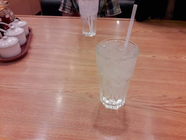 Clean drinking water in the glass on the table.