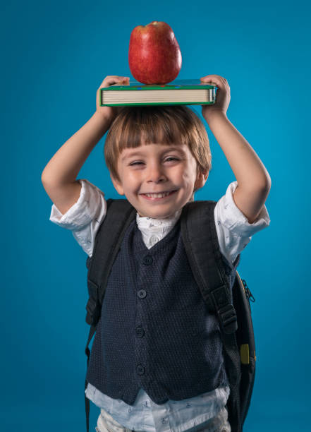 istock Happy little school boy over colored background 874716020