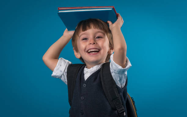 istock Happy little school boy over colored background 874719804