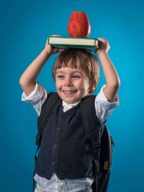 istock Happy little school boy over colored background 874719890