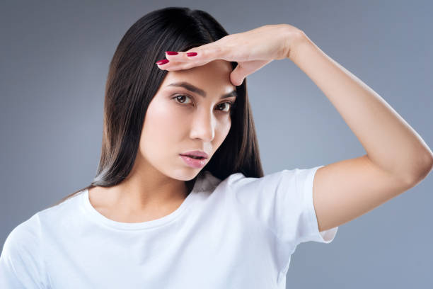 istock Beautiful attentive woman looking for her cat while being at home 874722978