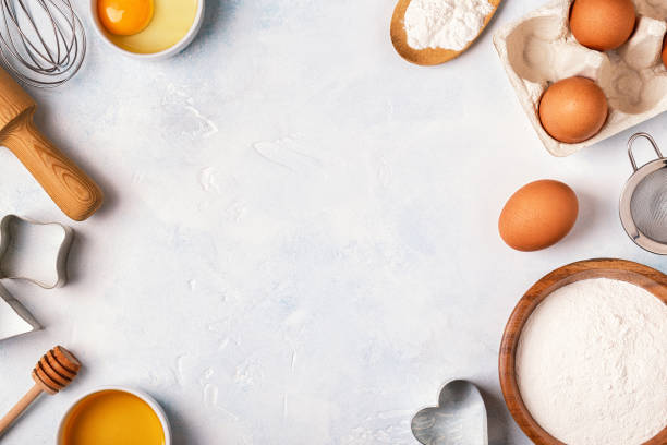 istock Ingredients for baking  - flour, wooden spoon, rolling pin, eggs. 874723450
