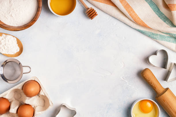 istock Ingredients for baking  - flour, wooden spoon, rolling pin, eggs. 874723488
