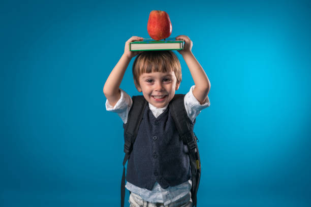 istock Happy little school boy over colored background 874723520