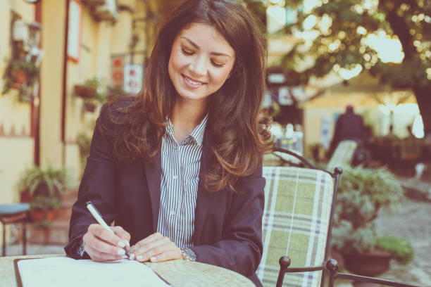 istock Smiling woman working at cafe. Close up. 874725010