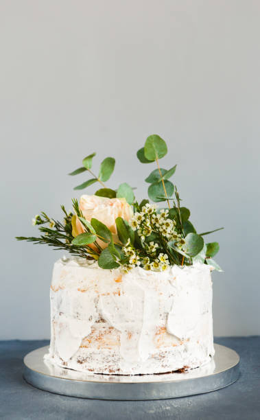 istock White creamy wedding cake with roses copy space 874726978