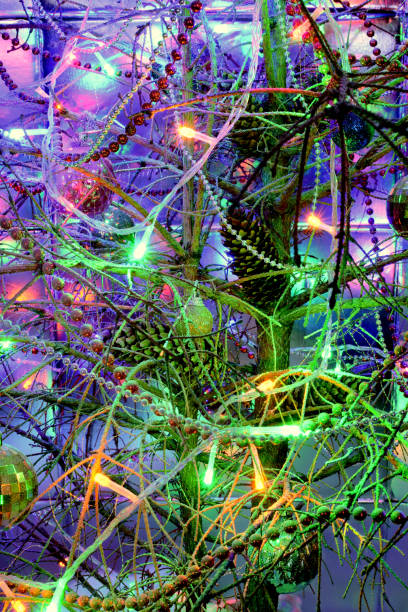 istock Christmas tree, abstract multicolored bright lights on holiday 874730844