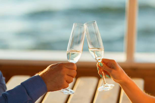 istock Happy couple drinks champagne on a yacht 874735856