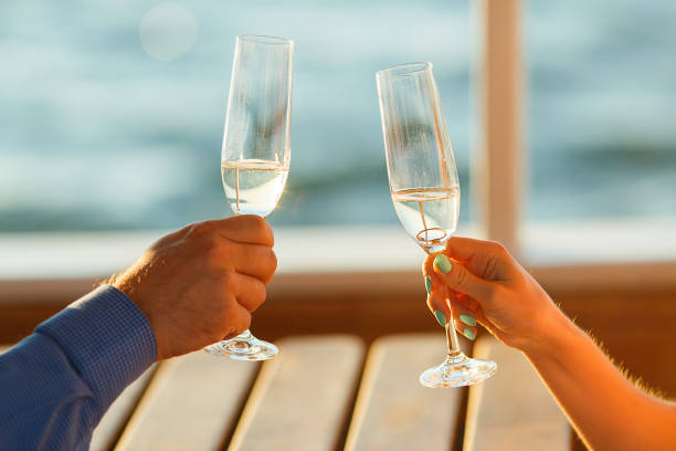 istock Happy couple drinks champagne on a yacht 874736038