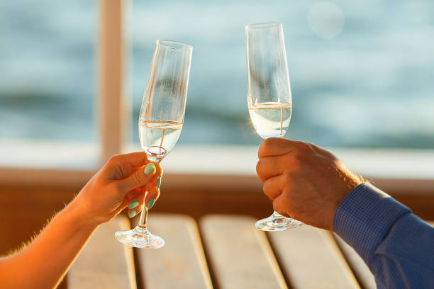 istock Happy couple drinks champagne on a yacht 874738118