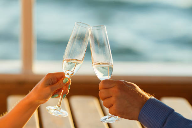 istock Happy couple drinks champagne on a yacht 874738150