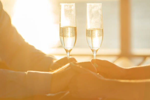istock Happy couple drinks champagne on a yacht 874738190