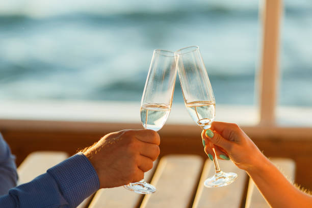 istock Happy couple drinks champagne on a yacht 874738226
