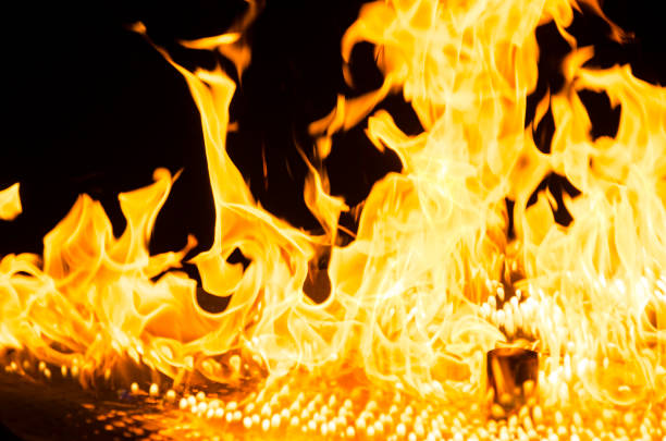 istock flames of fire isolated on black background. 874738674