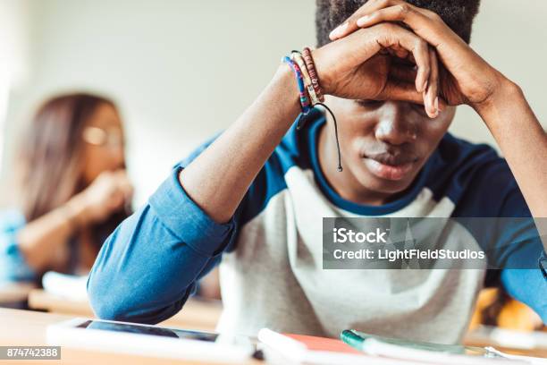 African American Student Sitting In Class Stock Photo - Download Image Now - Depression - Sadness, Student, Education