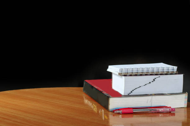istock Education concept,book and pen on wood table 874744922