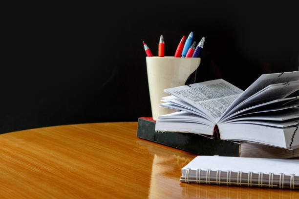 istock Education concept,book and pen on wood table 874745002