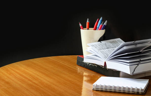 istock Education concept,book and pen on wood table 874745122