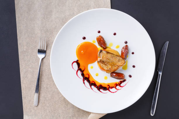 istock Roasted goose liver with date fruit and apple 874747504