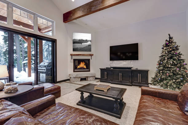 istock Vaulted ceiling living room with glass sliding doors to a patio 874753534