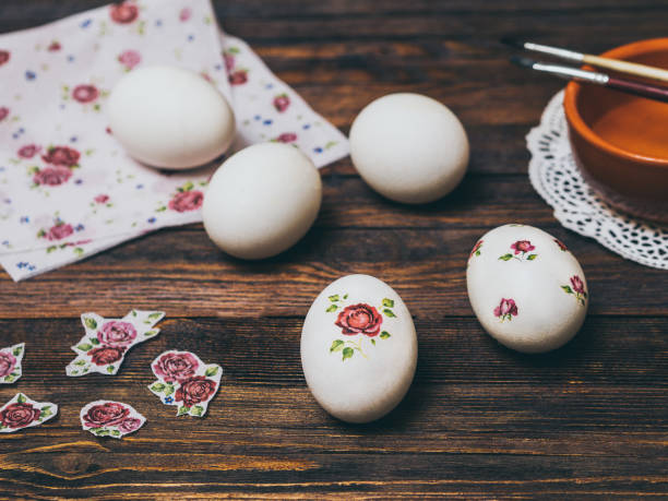 Easter Egg on wooden background decorated with technique of decoupage. The concept of a holiday and a happy Easter. Easter Egg on wooden background decorated with technique of decoupage. The concept of a holiday and a happy Easter. decoupage stock pictures, royalty-free photos & images