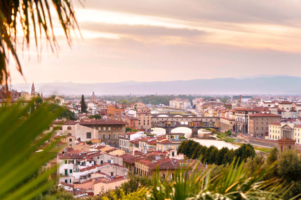 istock Florence city with Arno river and Ponte Vecchio bridge at sunset time. 874754554