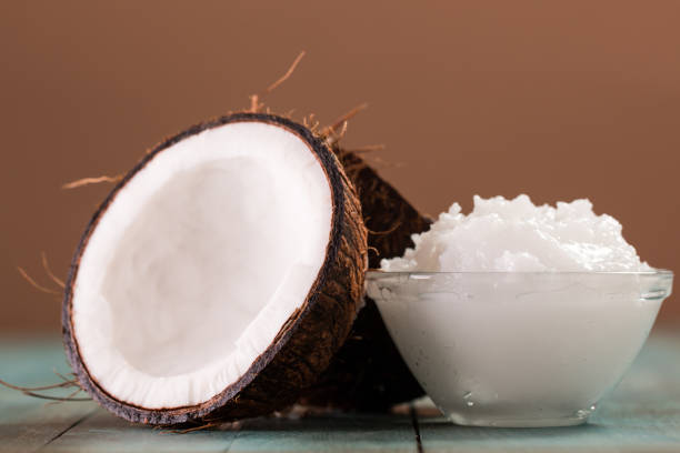 istock coconut oil and fresh coconuts on old wooden table 874757034