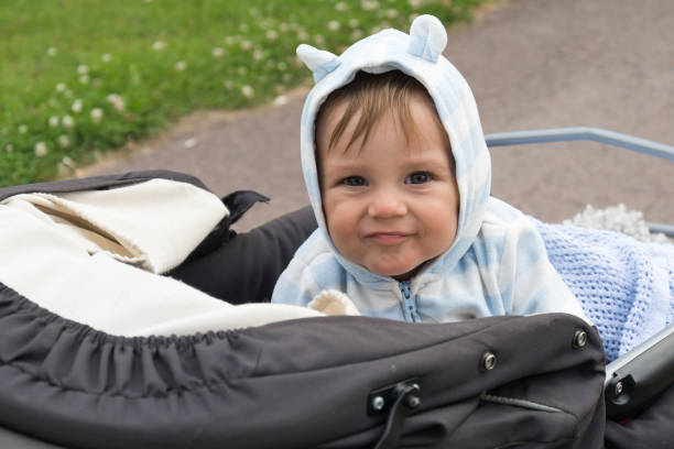 istock a boy in a baby stroller with funny ears 874760484