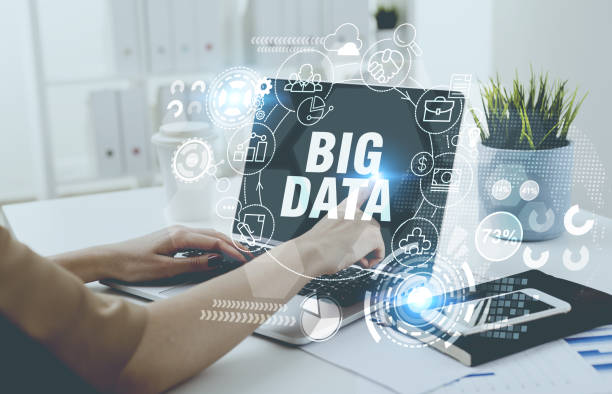istock Woman typing at laptop keyboard, big data hologram 874768072